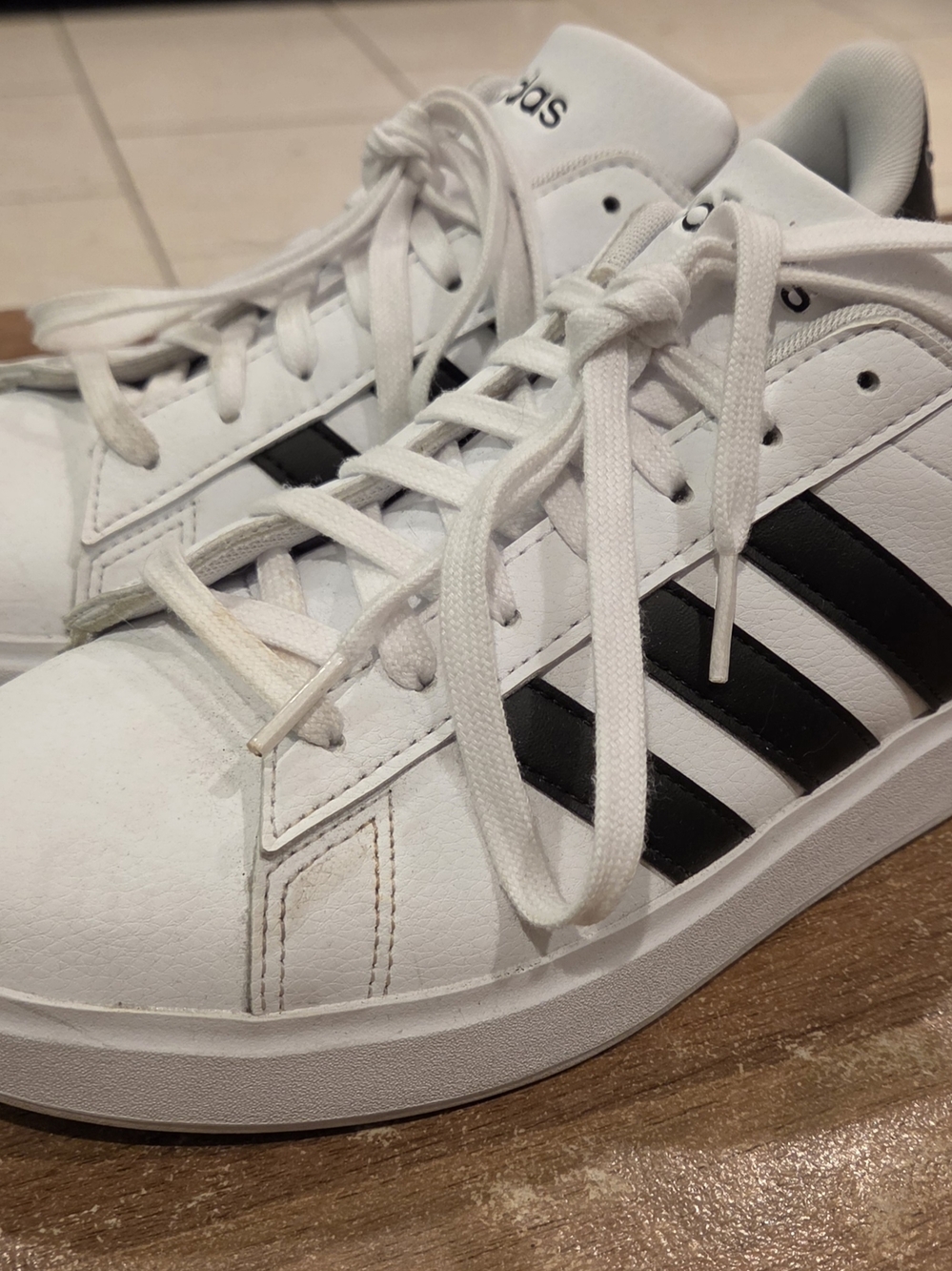 Adidas White Leather Sneakers with Black Stripes